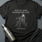 Dead Space sci-fi t-shirt — skeleton astronaut floating in space, 'Not all who wander are lost / some are dead' — Black unisex tee — Apsion Outpost