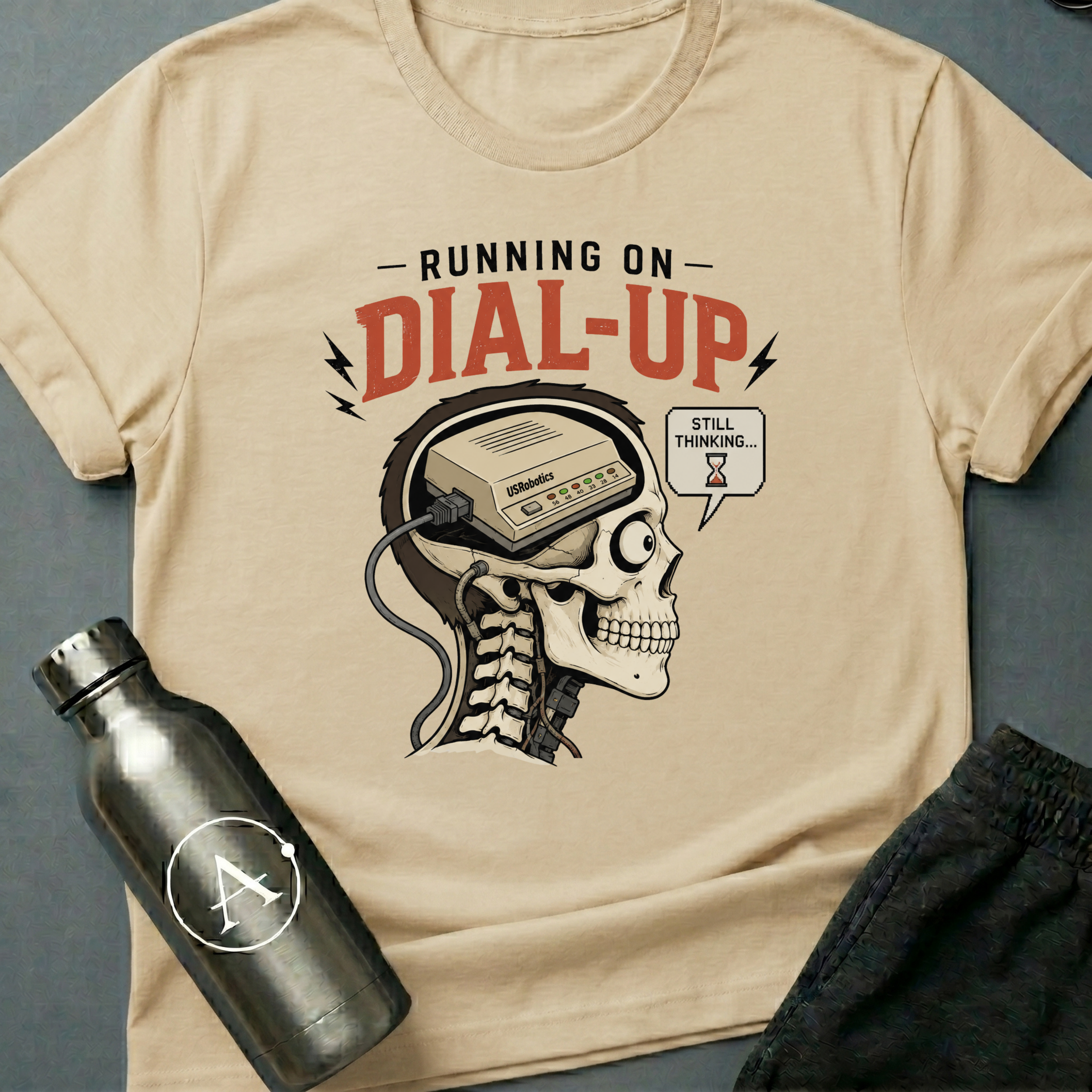 56K Brain sci-fi t-shirt — skull cross-section with vintage dial-up modem inside — Natural unisex tee — Apsion Outpost