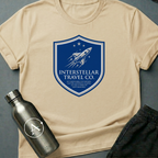 Tourist Disclaimer sci-fi t-shirt — Interstellar Travel Co. fine-print disclaimer shield — Natural unisex tee — Apsion Outpost