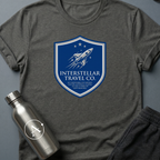 Tourist Disclaimer sci-fi t-shirt — Interstellar Travel Co. fine-print disclaimer shield — Dark Heather unisex tee — Apsion Outpost
