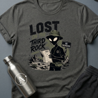 Tourist Trap sci-fi t-shirt — alien tourist lost on Earth with bucket hat and useless map — Natural unisex tee — Apsion Outpost