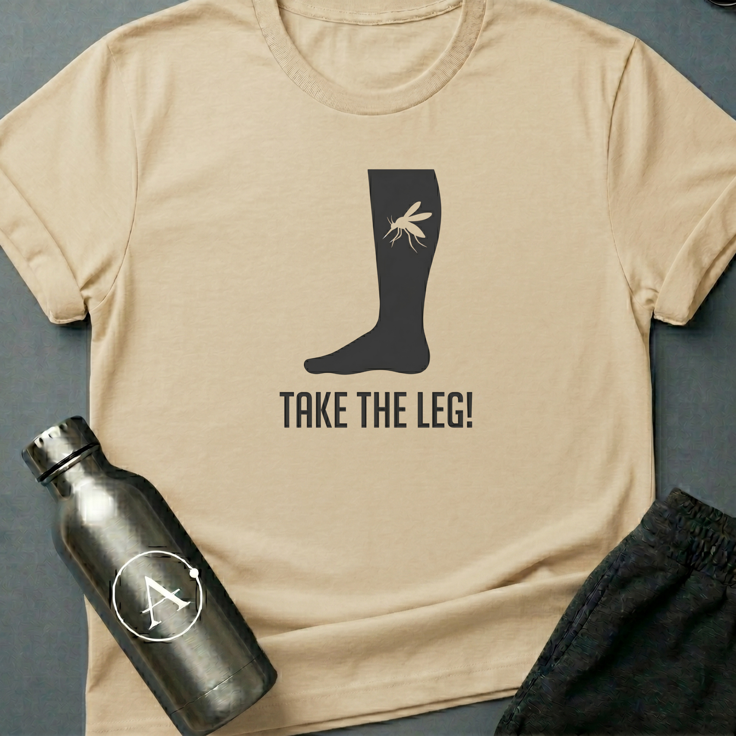 Better Safe Than Limbed sci-fi t-shirt — mosquito on a bare leg, dramatic overreaction — Natural unisex tee — Apsion Outpost