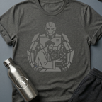 The Author sci-fi t-shirt — a human at the desk with a much larger silhouette working behind him — Dark Heather unisex tee — Apsion Outpost