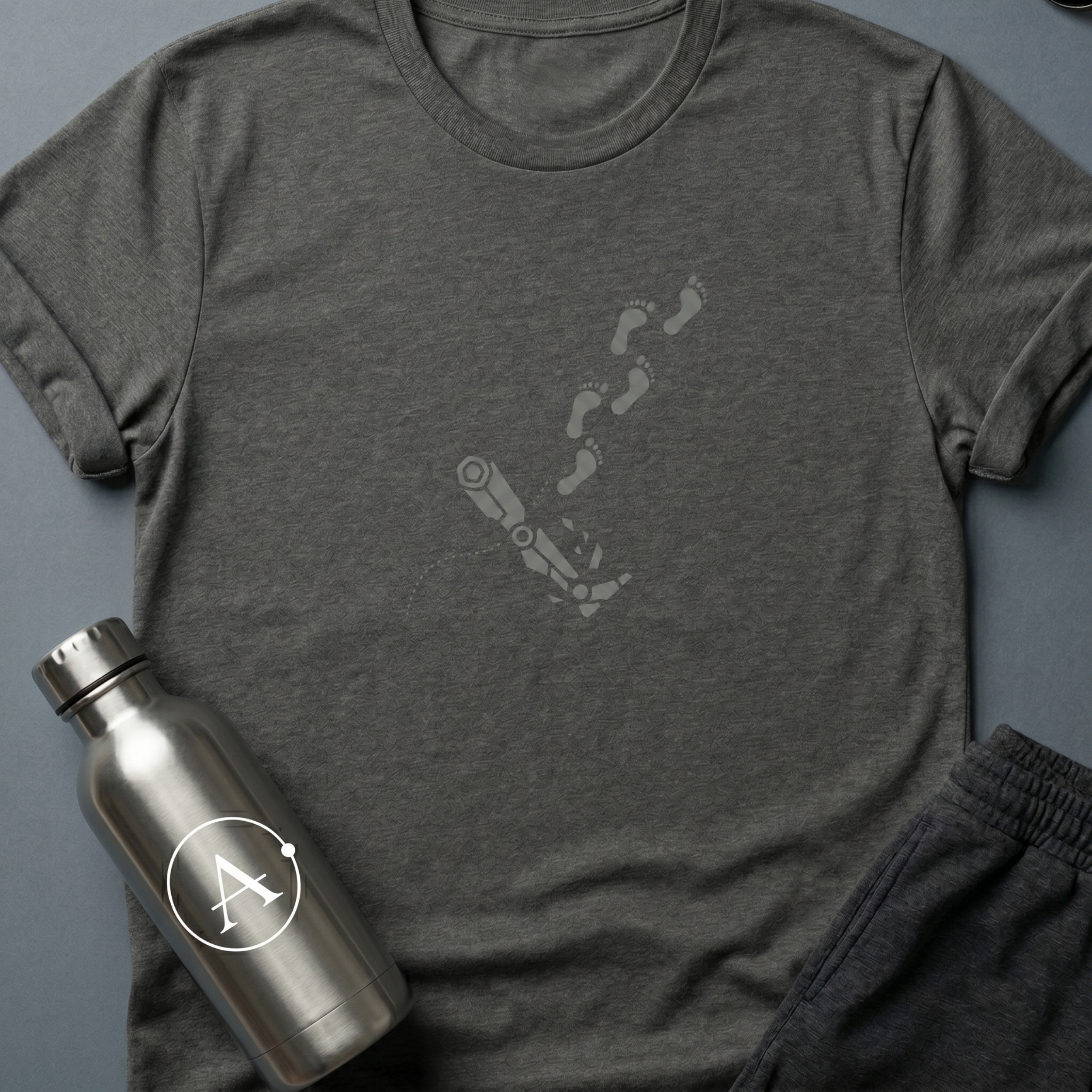 Walking on One Leg sci-fi t-shirt — a robot leg left behind, human footprints continuing on without it — Dark Heather unisex tee — Apsion Outpost