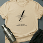 Through the Floor sci-fi t-shirt — a pen falling through a glitching grid where the collision mesh failed — Natural unisex tee — Apsion Outpost