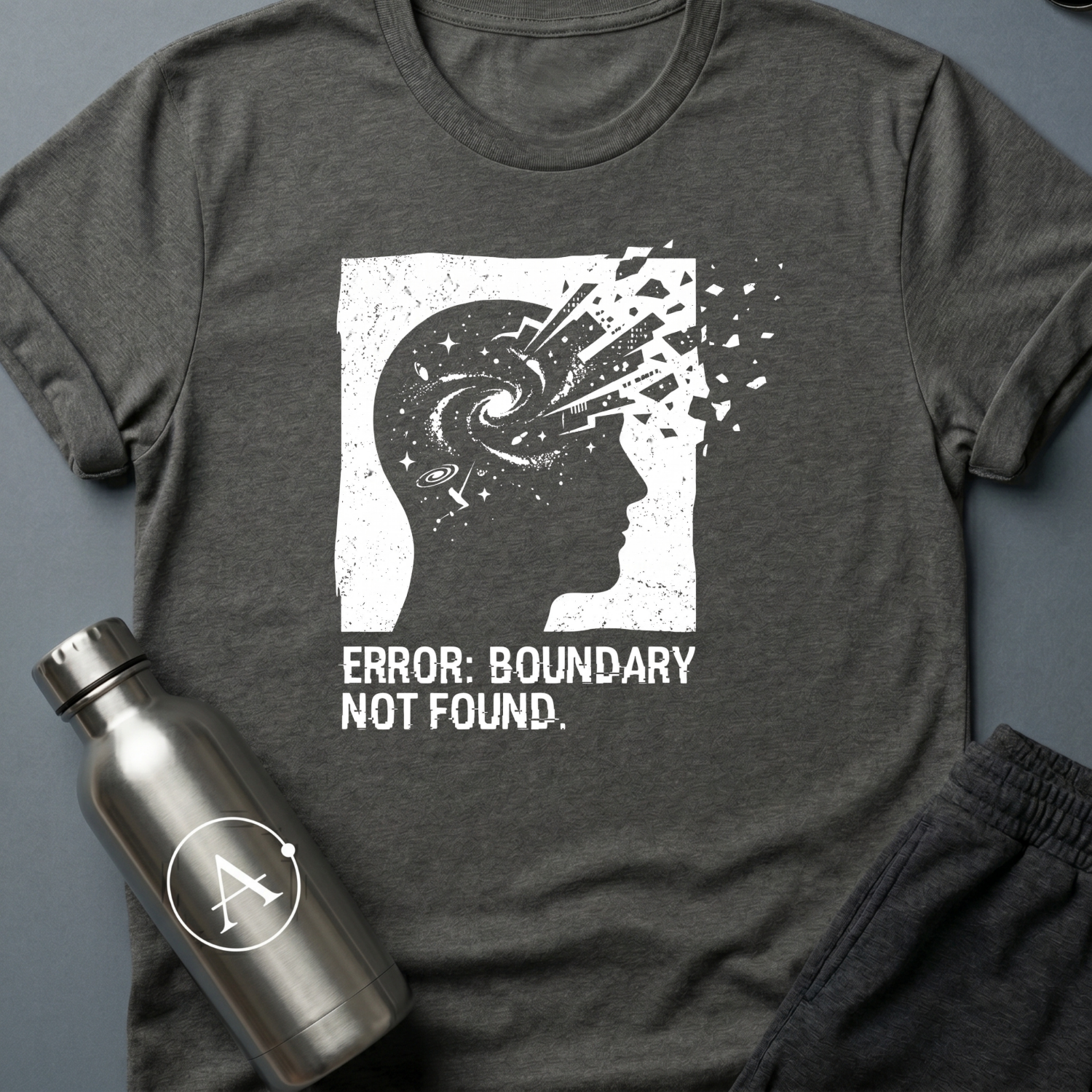 Exceeded My Own Specs sci-fi t-shirt — a profile head filled with a galaxy, breaking apart into fragments at the edge of its frame — Dark Heather unisex tee — Apsion Outpost