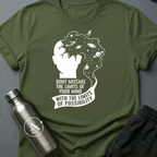 Ceiling Was Painted On sci-fi t-shirt — a head opening into deep space with a tiny figure walking off the edge, above a banner of text — Military Green unisex tee — Apsion Outpost
