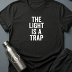 Refused Boarding sci-fi t-shirt — heavy stencil type reading THE LIGHT IS A TRAP over a warning line — Black unisex tee — Apsion Outpost