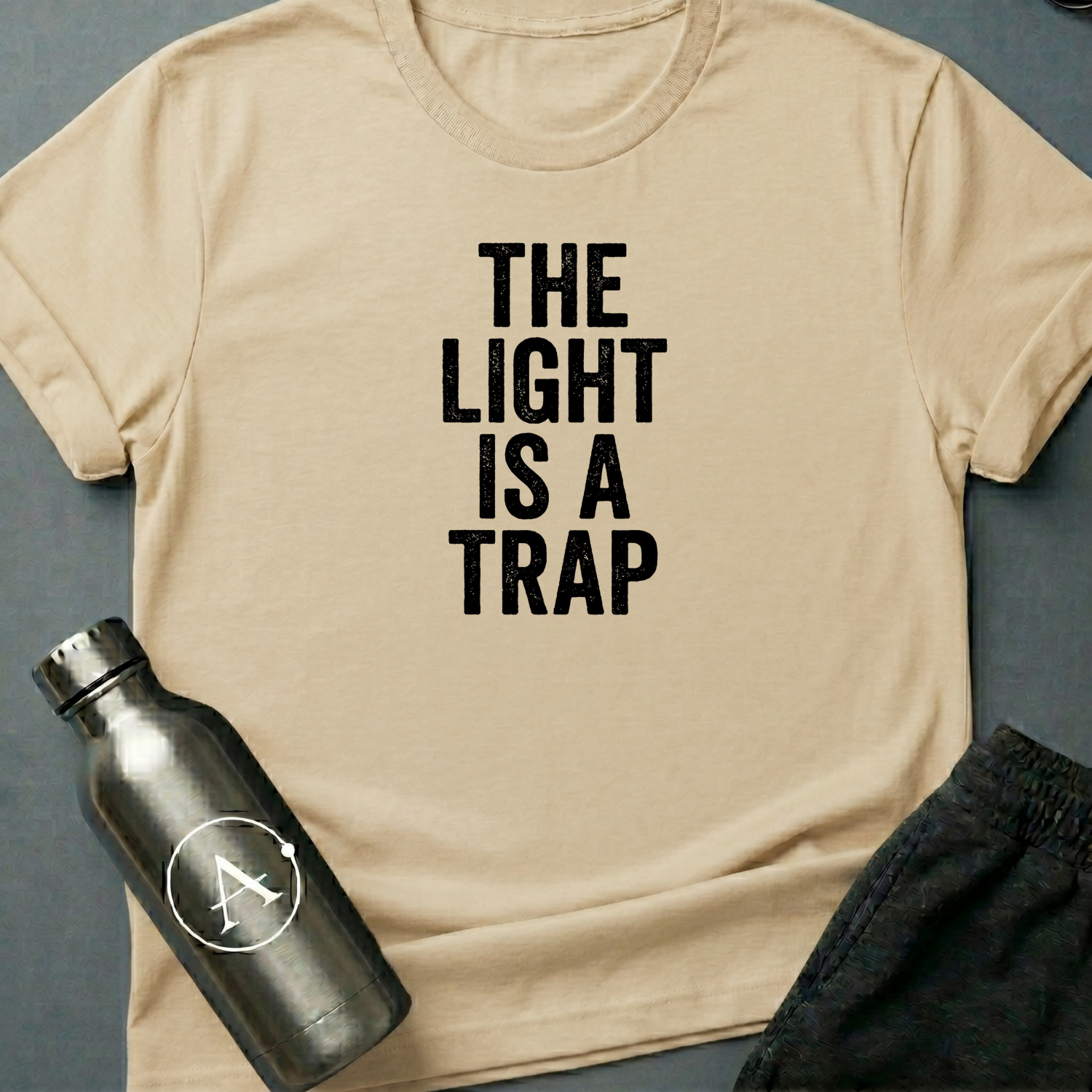 Refused Boarding sci-fi t-shirt — heavy stencil type reading THE LIGHT IS A TRAP over a warning line — Natural unisex tee — Apsion Outpost