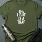 Refused Boarding sci-fi t-shirt — heavy stencil type reading THE LIGHT IS A TRAP over a warning line — Military Green unisex tee — Apsion Outpost