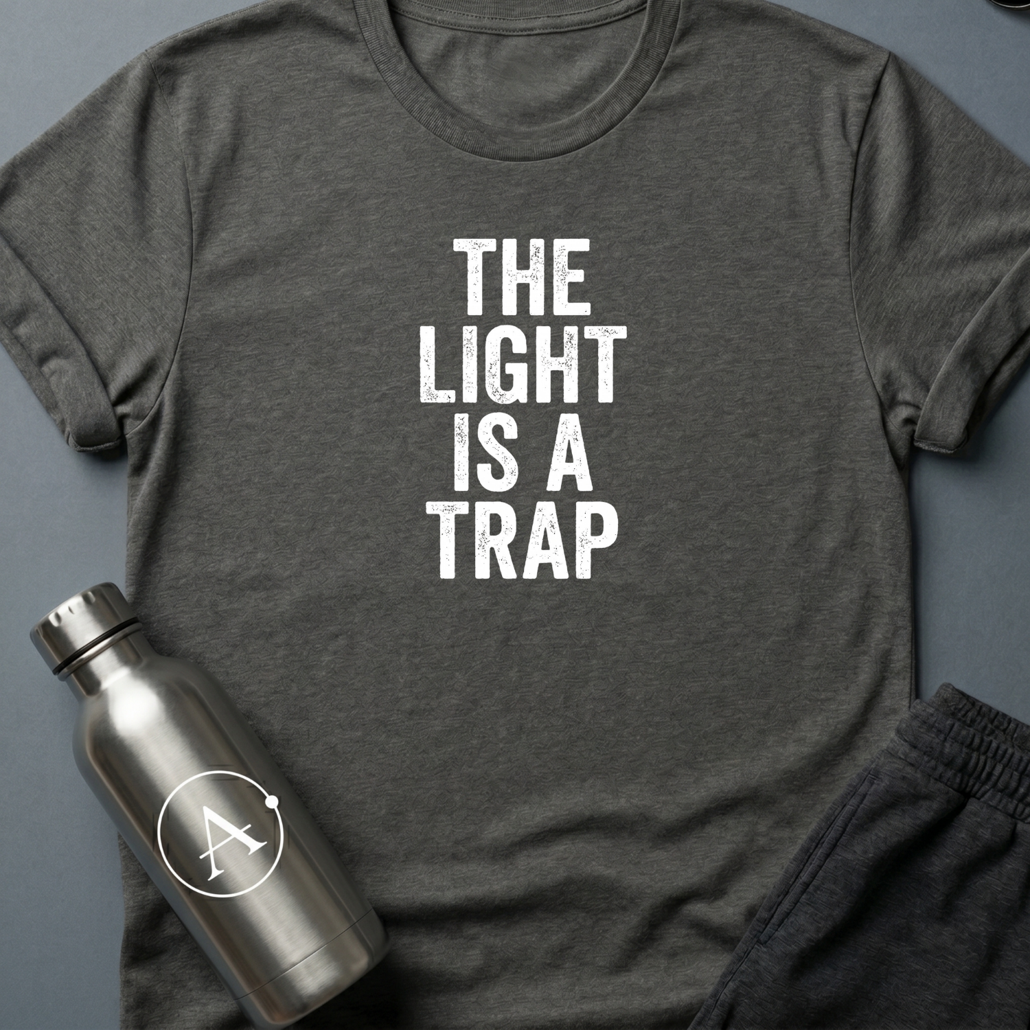 Refused Boarding sci-fi t-shirt — heavy stencil type reading THE LIGHT IS A TRAP over a warning line — Dark Heather unisex tee — Apsion Outpost