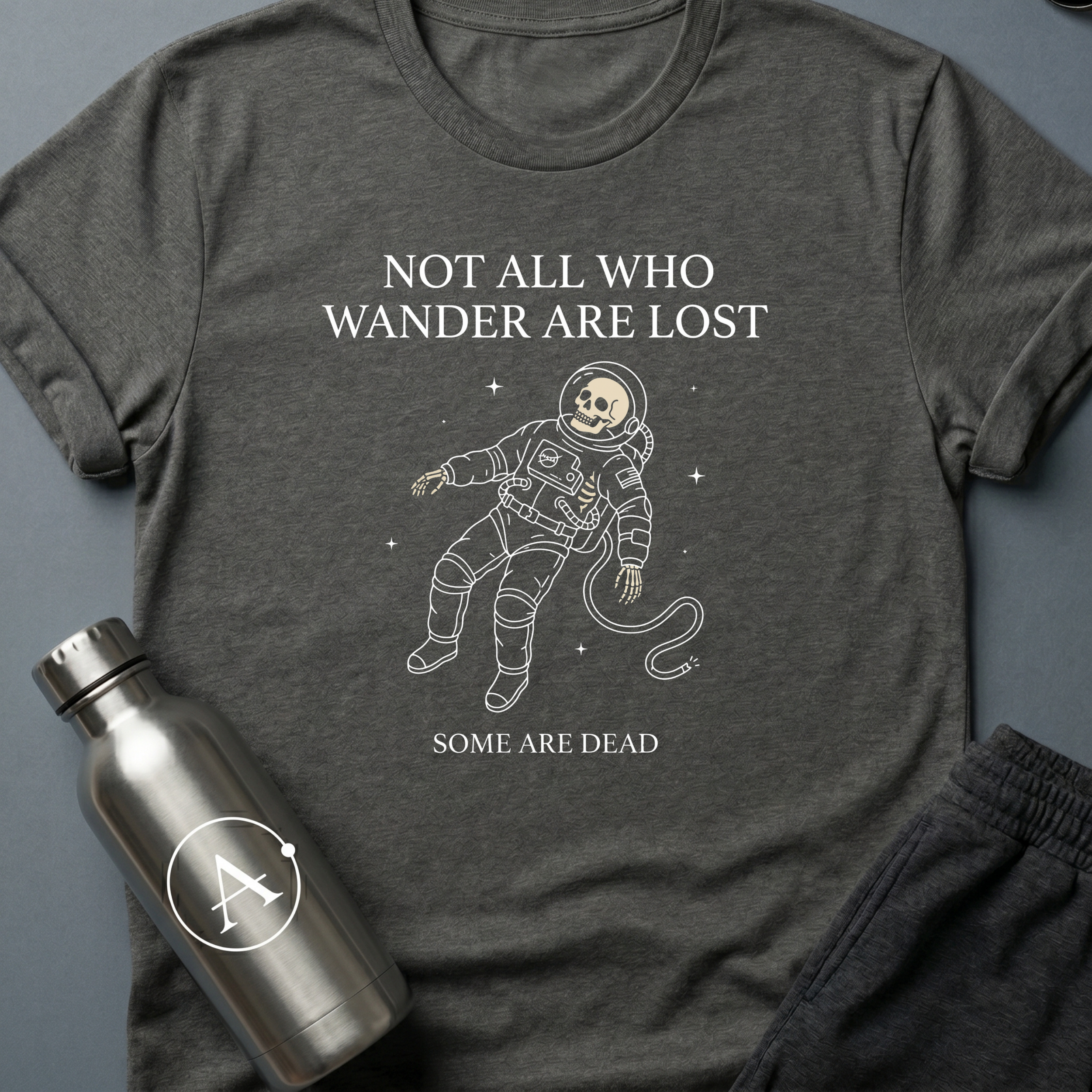 Dead Space sci-fi t-shirt — skeleton astronaut floating in space, 'Not all who wander are lost / some are dead' — Dark Heather unisex tee — Apsion Outpost
